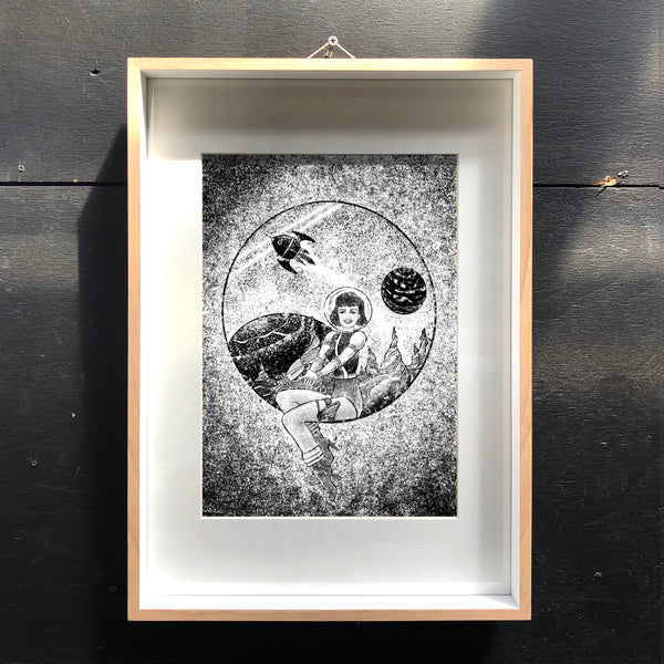 Example of the Space Cadet artwork framed on wall.